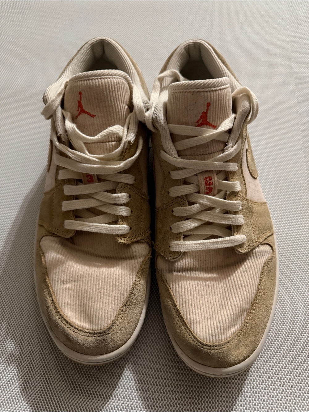 Jordan Low Top Sneakers in Beige and Cream with Red Logo